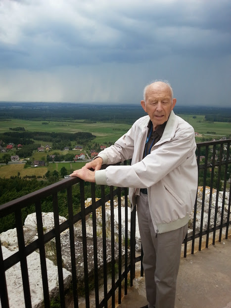 A guest taking in the Polish countryside from a hilltop viewpoint