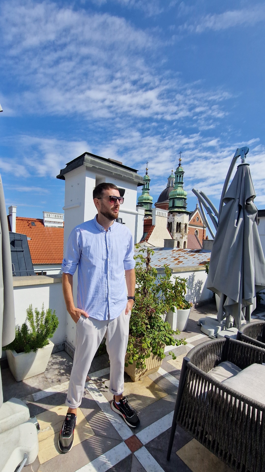 Damian Fort — founder of Polish Heritage Tours — on a rooftop in Kraków